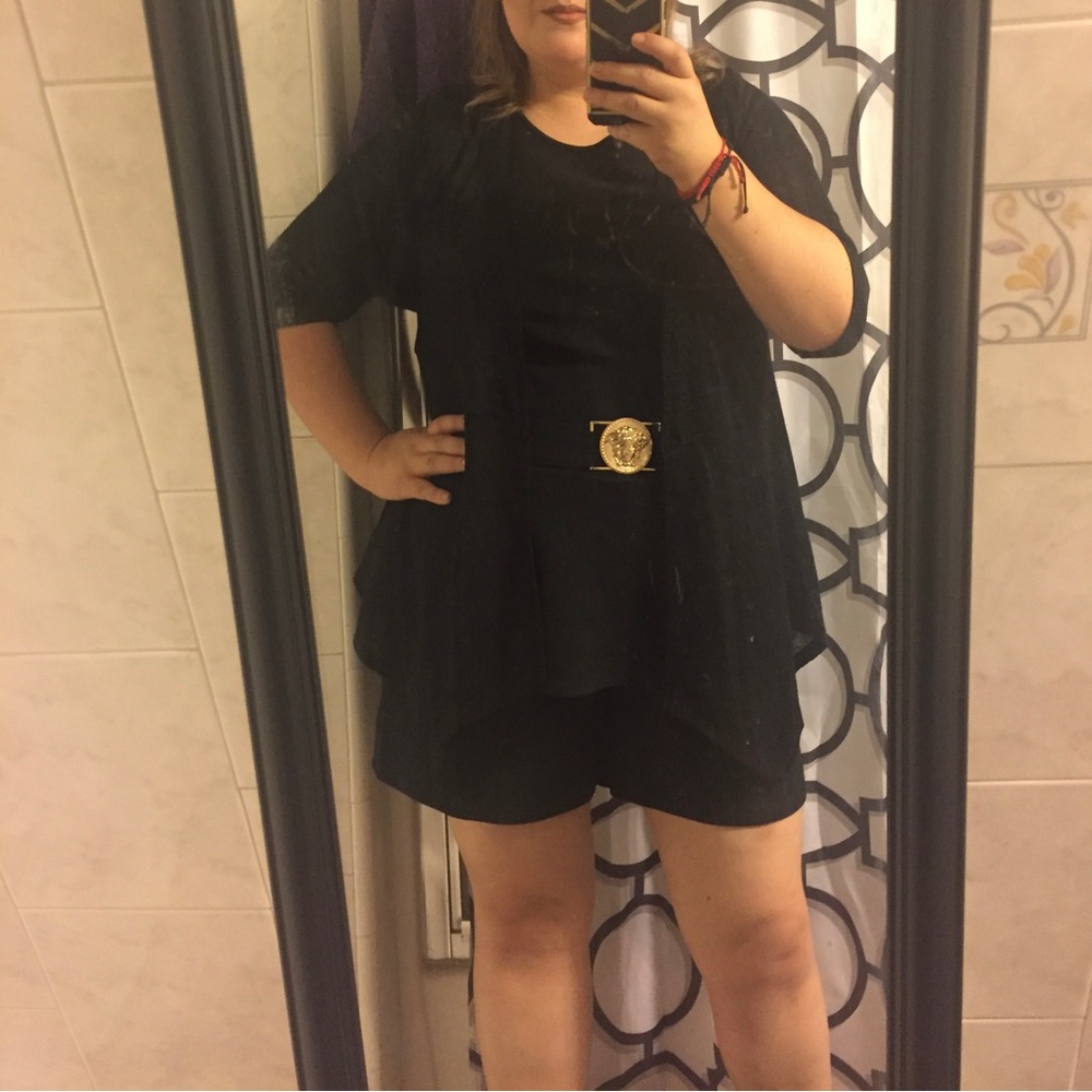 Ashley Stewart black romper (shorts) with gold detail at the waist.